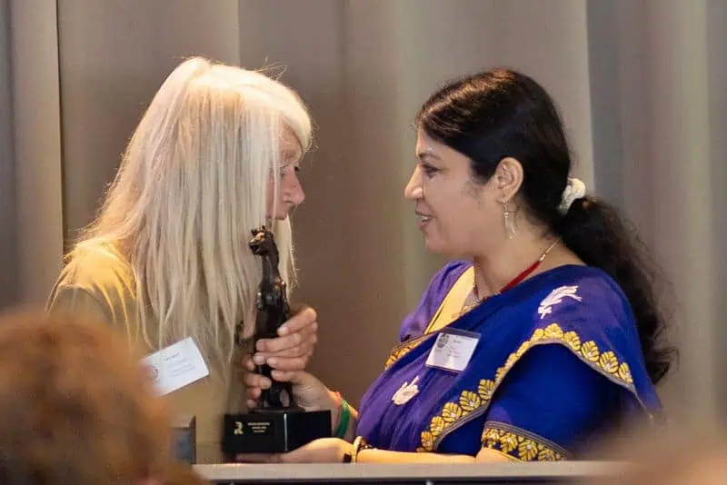 Global Rewilding Awards - Lucy Rees receives award from Purnima Devi Barman